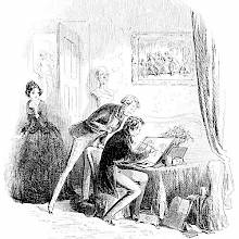 A man is sitting at a table drawing while another man stands behind him watching