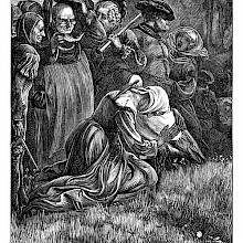 A woman kneels and hugs a stork as a group of people gather behind her